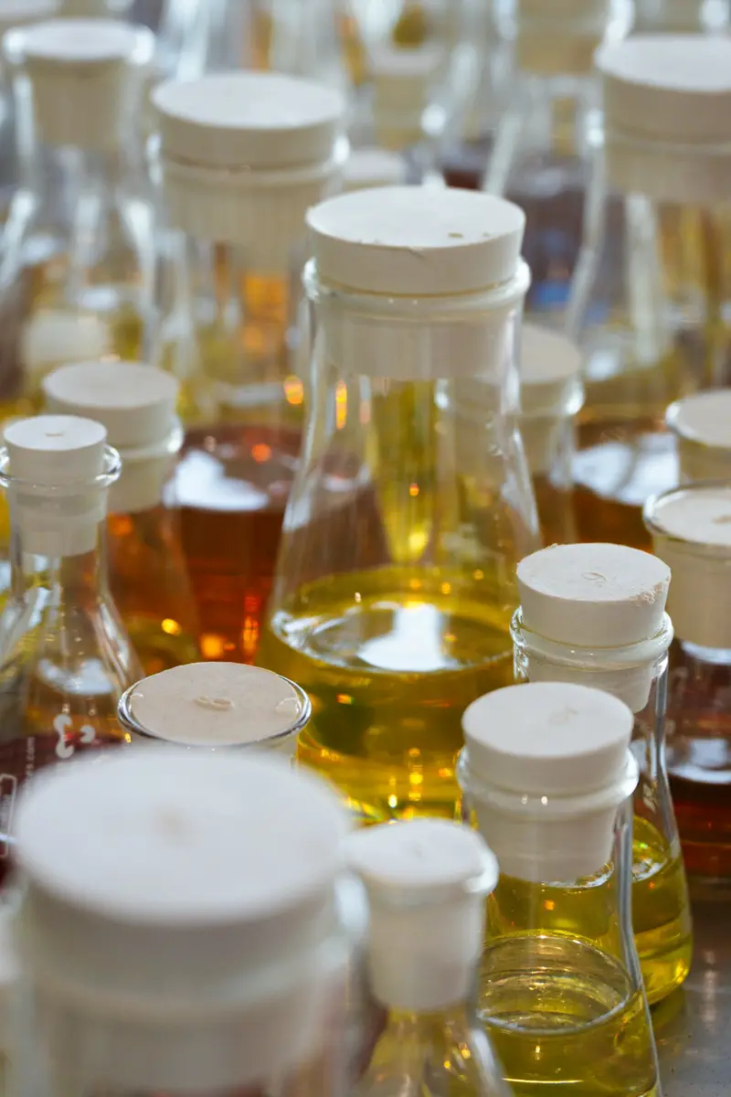 Laboratory glassware containing amber liquids